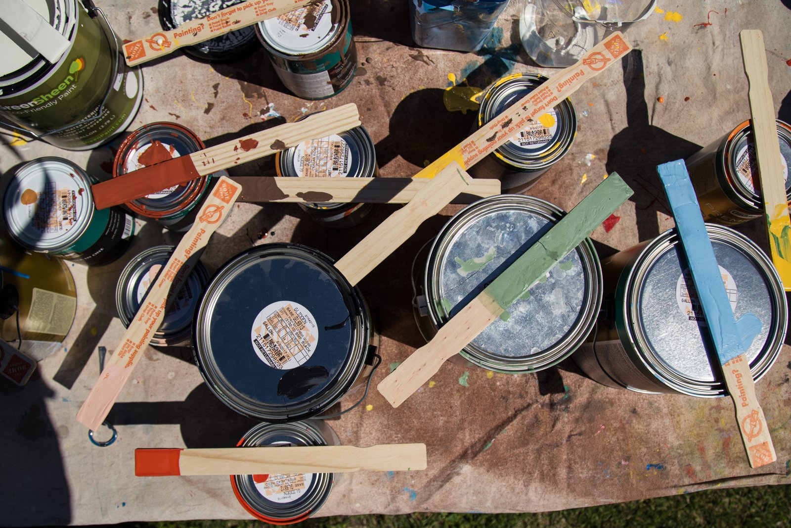 Paint cans and brushes prepared for a mural at Perkins Elementary School in Des Moines, Iowa.